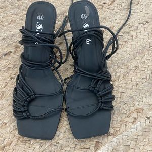 Strappy black heels